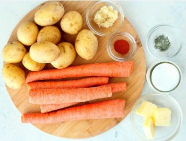 Roasted potatoes and carrots in oven